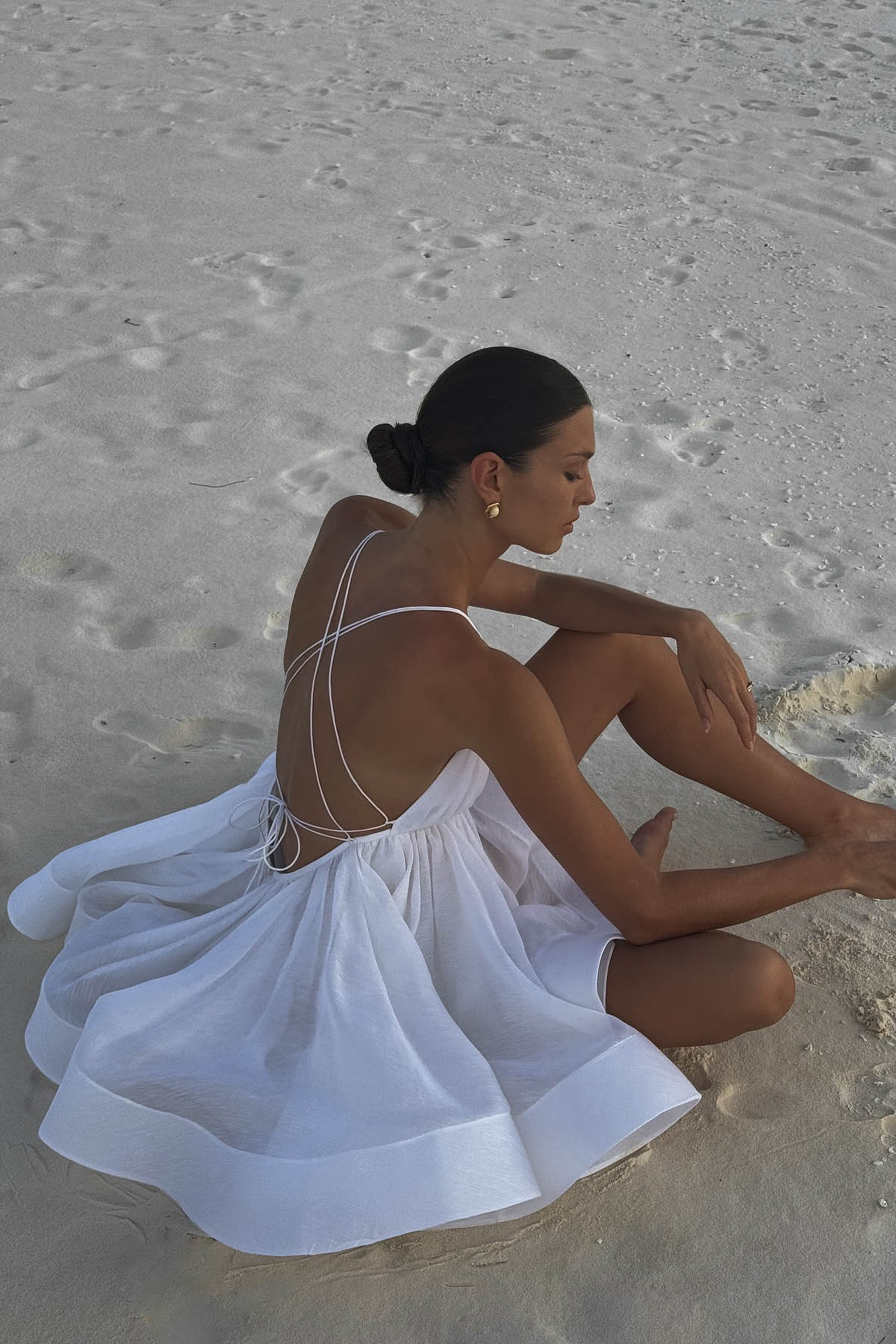 Backless Mini Dress with Flared Hem and Deep V Neckline